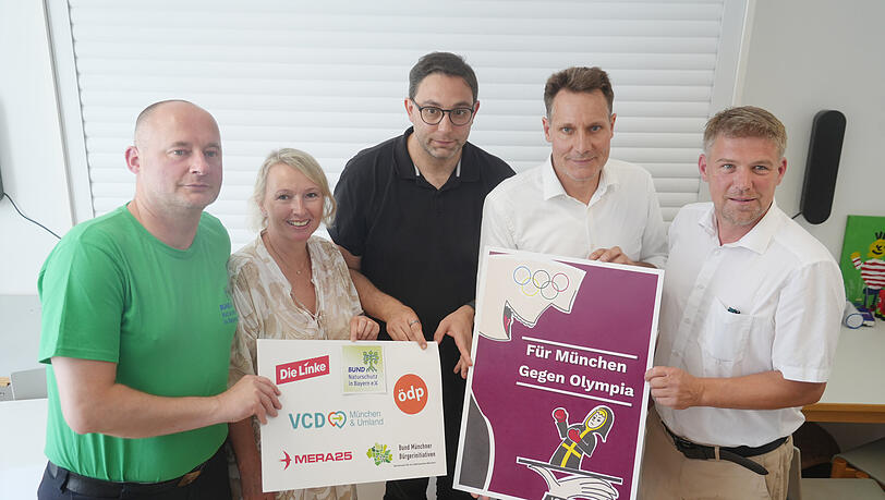 Noch ist das lila Plakat des Bündnisses NOlympia ein Provisorium. Die Gegner einer Münchner Olympia-Bewerbung arbeiten gerade an einer Plakatkampagne für ein Nein beim Bürgerentscheid am 26. Oktober. Florian Kaiser (BUND), Daniela Vogt (BMBI), Stefan Jagel (Linke), Ludwig Hartmann (Grüne) und Tobias Ruff (ÖDP, v.l.) hoffen, dass sich ihrem Bündnis in den nächsten Wochen noch viele Mitstreiter anschließen.