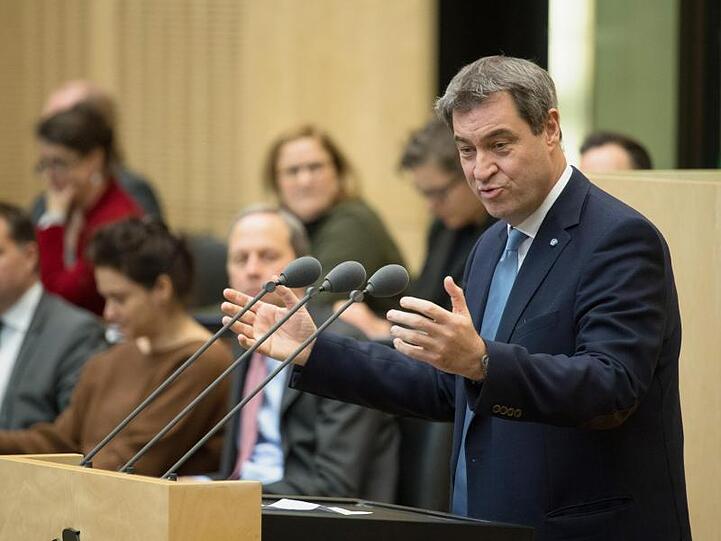 Markus Söder (r, CSU), Ministerpräsident von Bayern. Foto: Jörg Carstensen/dpa