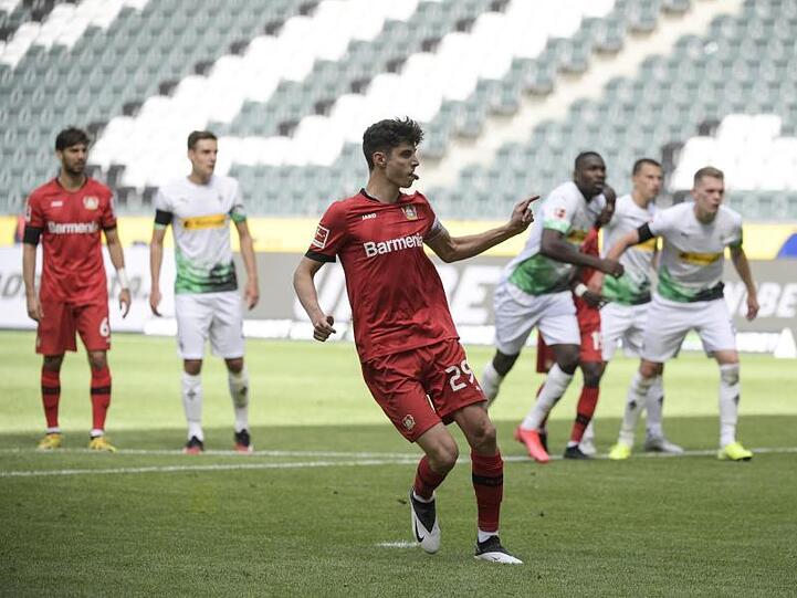 Leverkusens Mittelfeldspieler Kai Havertz (M) jubelt. Foto: Ina Fassbender/AFP-Pool/dpa/Archivbild