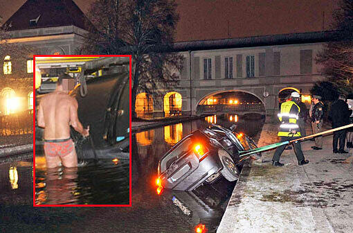 Coole Aktion: Nur mit der Unterhose bekleidet hilft dieser Mann bei der Bergung des Autos aus dem Nymphenburger Schlosskanal.