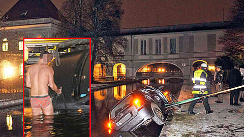 Coole Aktion: Nur mit der Unterhose bekleidet hilft dieser Mann bei der Bergung des Autos aus dem Nymphenburger Schlosskanal.