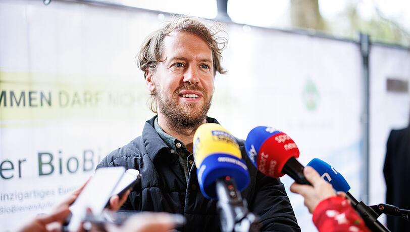 Sebastian Vettel, Rennfahrer, spricht.