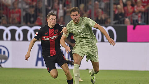 Werden sich am Samstag erneut ein Kopf-an-Kopf-Rennen liefern: Leverkusens Florian Wirtz (links) und Leon Goretzka.