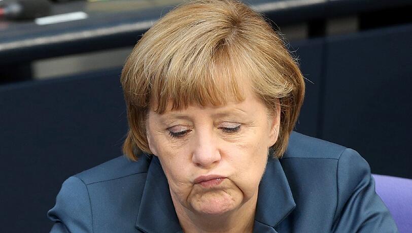 Glücklich wirkte Merkel nicht während der Debatte um die Frauenquote. Glücklich wirkte Merkel nicht während der Debatte um die Frauenquote.