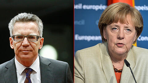 Bundesinnenminister Thomas de Maiziere und Kanzlerin Angela Merkel.
