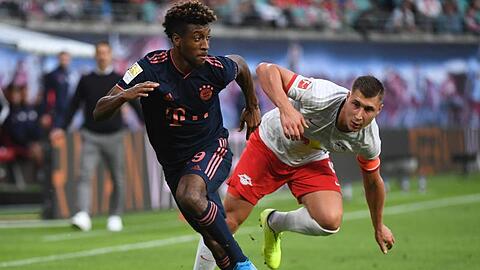 Willi Orban (r) von Leipzig in Aktion gegen Kingsley Coman von München. Foto: Hendrik Schmidt/dpa-Zentralbild/dpa/Archivbild