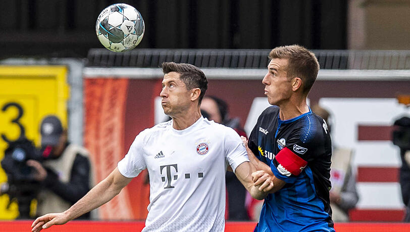 Robert Lewandowski (l.) vergab erste eine große Chance in Paderborn, am Ende traf er doch noch per sehenswertem Lupfer. Robert Lewandowski (l.) vergab erste eine große Chance in Paderborn, am Ende traf er doch noch per sehenswertem Lupfer.