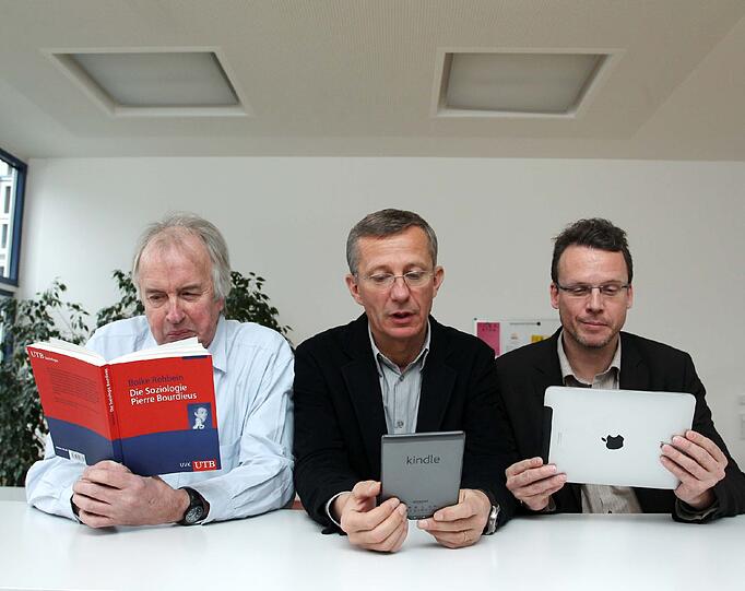 AZ-Redakteure Michael Heinrich, Matthias Maus und Georg Thanscheidt im Lesetest.