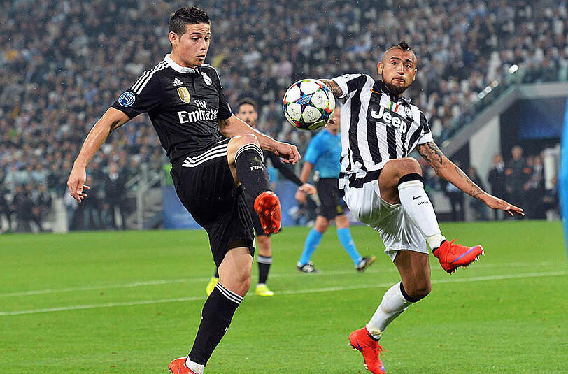 Juventus schaltete im Halbfinale Real Madrid aus: Hier stemmt sich Arturo Vidal (rechts) James Rodriguez entgegen.