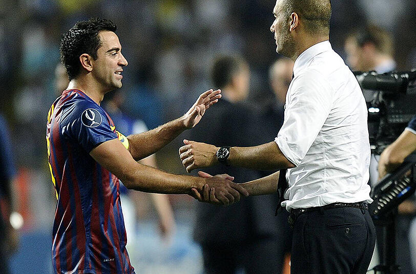 Xavi Hernandez (l.) trainierte von 2008 bis 2011 unter Pep Guardiola
