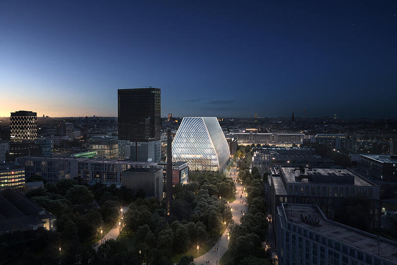 Das geplante Konzerthaus im Werksviertel hinter dem Ostbahnhof, dessen Lichter im Hintergrund rechts leuchten. Der Entwurf für den Bau stammt vom Bregenzer Atelier der Architekten Andreas Cukrowicz und Anton Nachbaur-Sturm.