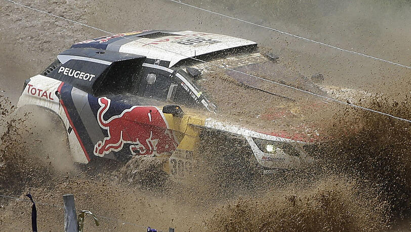 Der französiche Fahrer Sebastien Loeb und sein Beifahrer Daniel Elena aus Monaco in ihrem Peugeot. Der französiche Fahrer Sebastien Loeb und sein Beifahrer Daniel Elena aus Monaco in ihrem Peugeot.