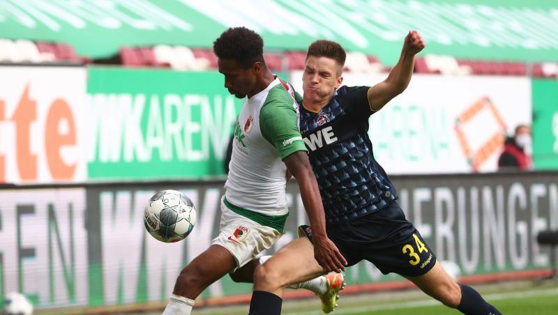 Noah Sarenren Bazee (l) vom FC Augsburg in Aktion gegen Noah Katterbach vom FC Köln. Foto: Michael Dalder/Reuters-Pool/dpa Noah Sarenren Bazee (l) vom FC Augsburg in Aktion gegen Noah Katterbach vom FC Köln. Foto: Michael Dalder/Reuters-Pool/dpa