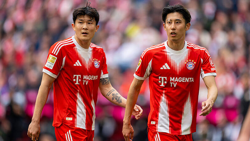 Min-jae Kim (l.) und Hiroki Ito sind beim FC Bayern nur Erg&auml;nzungsspieler. Beiden w&uuml;rde der Rekordmeister wohl keine Steine in den Weg legen.