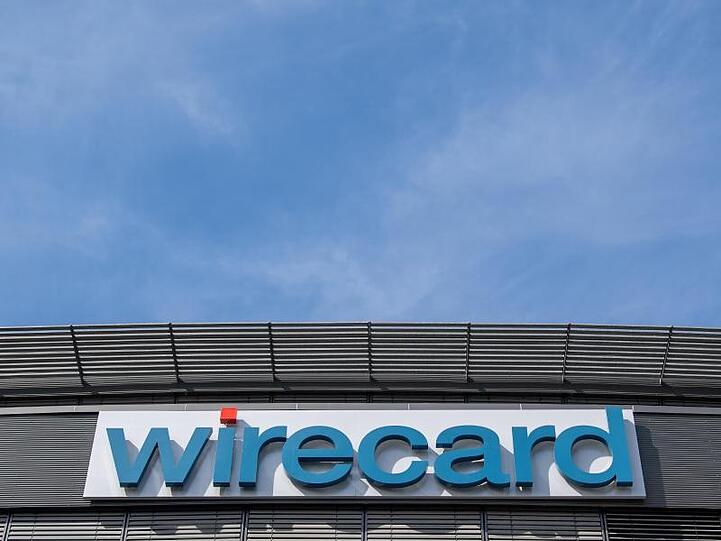 Der Schriftzug von Wirecard an der Firmenzentrale des Zahlungsdienstleisters. Foto: Peter Kneffel/dpa/Archivbild