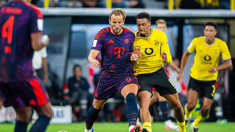 Enges Duell: Bayerns Harry Kane (l.) und der Dortmunder Felix Nmecha. Enges Duell: Bayerns Harry Kane (l.) und der Dortmunder Felix Nmecha.
