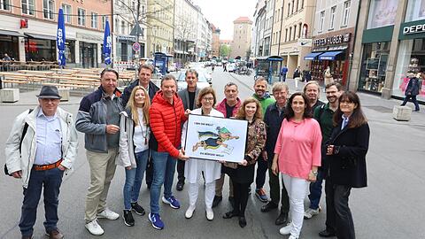 Die "Bürgerinitiative Tal" präsentiert ihr neues Comic-Maskottchen, den "Bürgerwille". Der soll helfen, dass sie im Rathaus gehört werden.