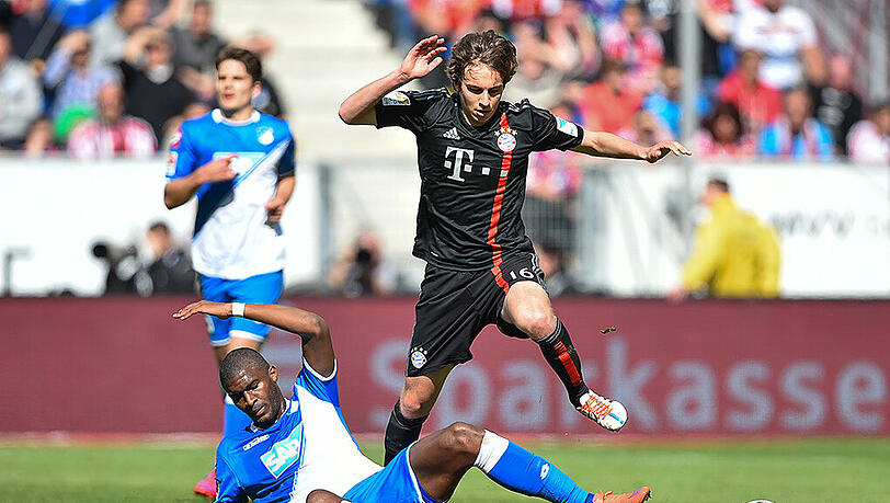 29. Spieltag der Bundesliga-Saison 2014/2015: Noch-Bayern-Profi Gianluca Gaudino im Duell mit Anthony Modeste (jetzt 1. FC Köln) von der TSG 1899 Hoffenheim. 29. Spieltag der Bundesliga-Saison 2014/2015: Noch-Bayern-Profi Gianluca Gaudino im Duell mit Anthony Modeste (jetzt 1. FC Köln) von der TSG 1899 Hoffenheim.