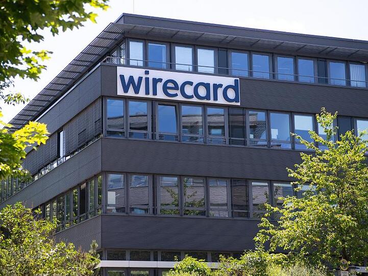 Der Schriftzug von Wirecard ist an der Firmenzentrale zu sehen. Foto: Sven Hoppe/dpa/Symbolbild