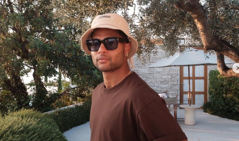 Serge Gnabry mit Hut und Sonnenbrille. Teamkollege Manuel Neuer hat das Bild mit "Sunset" kommentiert.