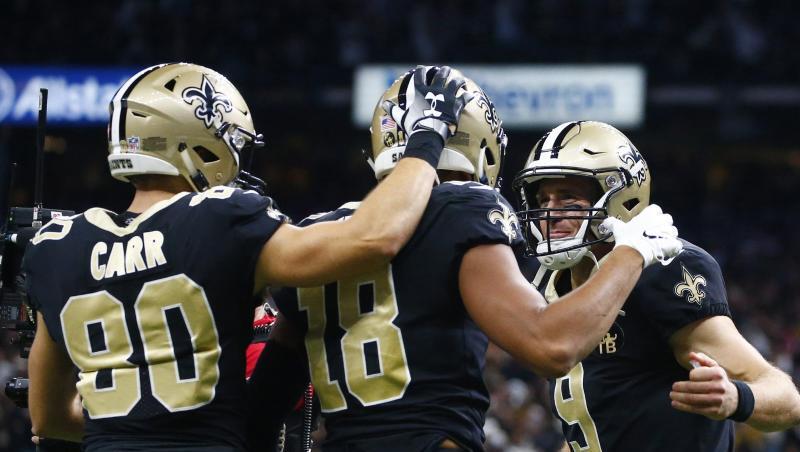 Quarterback Drew Brees (r), Austin Carr (l/80) und Keith Kirkwood (M/18) von den New Orleans Saints jubeln nach einem Touchdown-Pass. Quarterback Drew Brees (r), Austin Carr (l/80) und Keith Kirkwood (M/18) von den New Orleans Saints jubeln nach einem Touchdown-Pass.