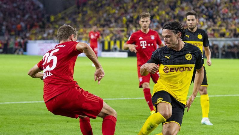 Treffen im Bundesliga-Topspiel aufeinander: Dortmunds Nico Schulz (r) und Bayerns Thomas Müller. Treffen im Bundesliga-Topspiel aufeinander: Dortmunds Nico Schulz (r) und Bayerns Thomas Müller.