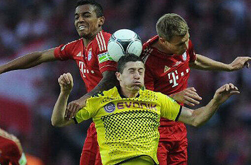 Duell im Pokalfinale 2012: Luiz Gustavo und Holger Badstuber nehmen BVB-Torjäger Robert Lewandowski in die Zange. Dortmund gewann 5:2.