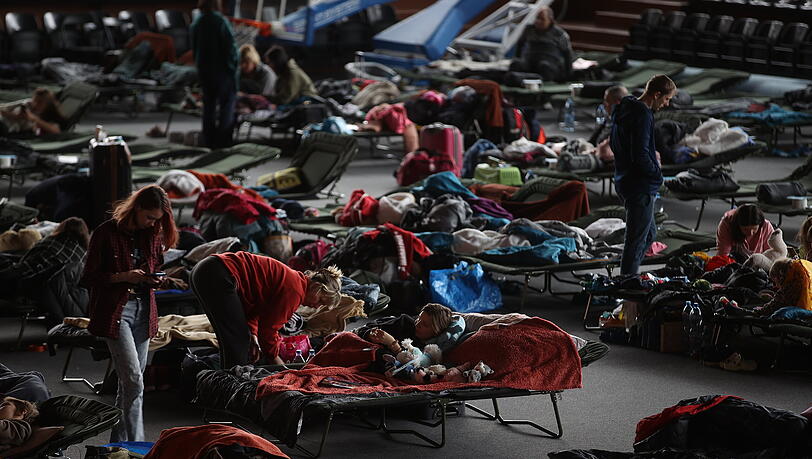 Flüchtlinge aus der Ukraine in einer Aufnahmestelle für Flüchtlinge in Krakau. Flüchtlinge aus der Ukraine in einer Aufnahmestelle für Flüchtlinge in Krakau.
