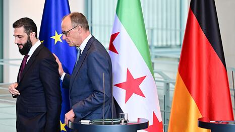 Wer hat die 80-Prozent-Zielmarke genannt, Syriens &Uuml;bergangspr&auml;sident Ahmed al-Scharaa oder Kanzler Friedrich Merz (CDU)? Nicht so wichtig, meint die Bundesregierung.