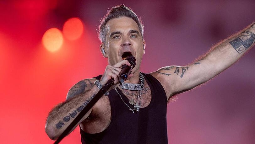 Robbie Williams bei einem Konzert in München.