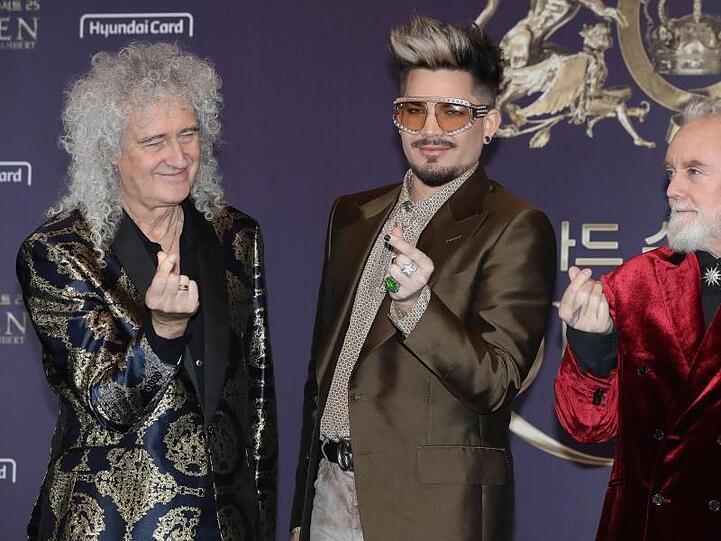 Mitglieder der britischen Band Queen: Brian May (l-r), Gitarrist, Adam Lambert, Sänger (Ersatz für den verstorbenen Leadsänger Freddy Mercury)und Roger Taylor, Schlagzeug.