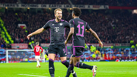 Harry Kane (l.) bereitete den entscheidenden Treffer von Kingsley Coman gegen Manchester United vor.