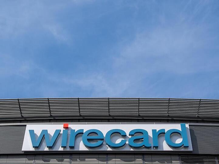 Der Schriftzug von Wirecard an der Firmenzentrale des Zahlungsdienstleisters. Foto: Peter Kneffel/dpa/Archivbild