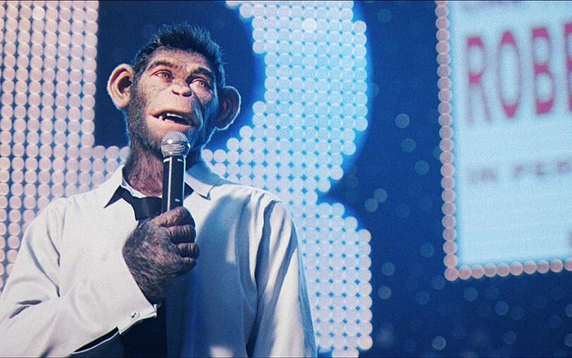 Robbie wird mit Take That zum international gefeierten Star, möchte aber lieber seine eigenen Songs singen. Robbie wird mit Take That zum international gefeierten Star, möchte aber lieber seine eigenen Songs singen.