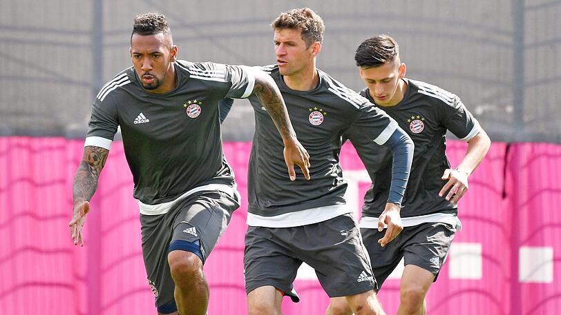 Vom FC Bayern zum DFB-Team: Jerome Boateng (li.) und Thomas Müller.