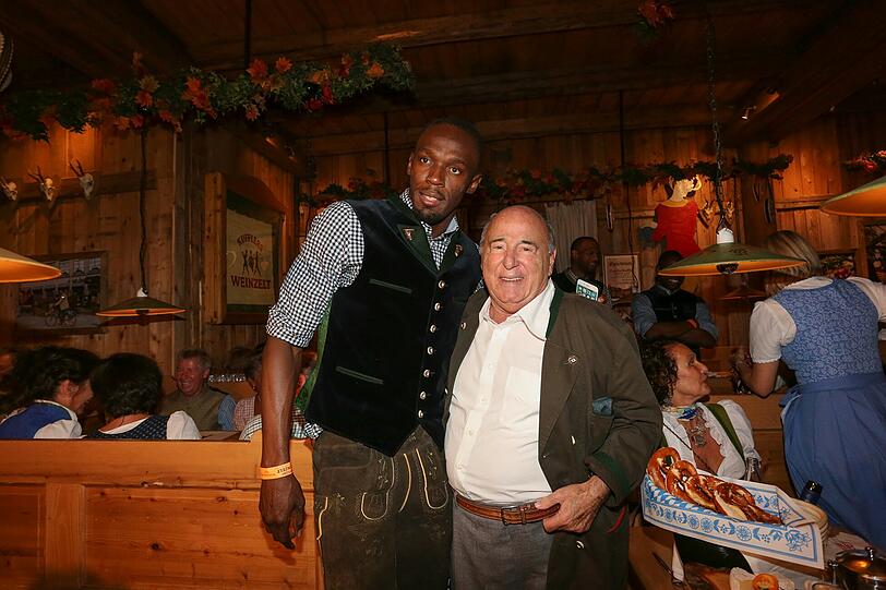 Usain Bolt zusammen mit Roland Kuffler.