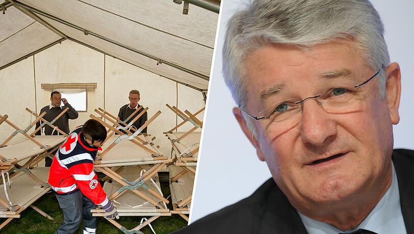 Mitarbeiter vom Bayerischen Roten Kreuz bauen Feldbetten in einer Notunterkunft für Flüchtlinge auf. Laut BRK-Chef Theo Zellner brauch es noch mehr Helfer. Mitarbeiter vom Bayerischen Roten Kreuz bauen Feldbetten in einer Notunterkunft für Flüchtlinge auf. Laut BRK-Chef Theo Zellner brauch es noch mehr Helfer.