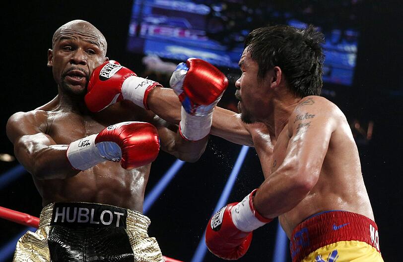 Floyd Mayweather hat den Angriff von Manny Pacquiao im Rekord-Boxkampf erfolgreich abgewehrt und bleibt auch in seinem 48. Profi-Duell ungeschlagen. Der Fight in Bildern.
