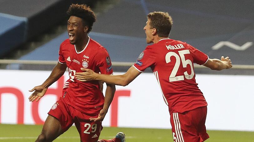Jubel in Ekstase: Coman lässt sich von Thomas Müller kaum einfangen.