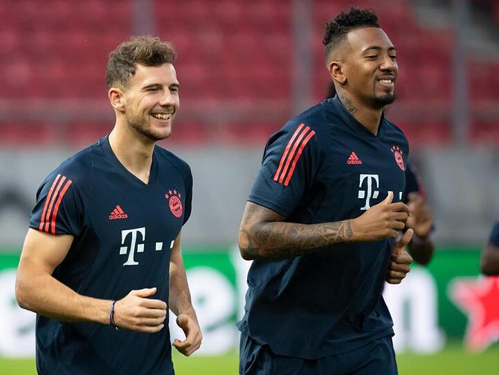 Leon Goretzka (l) und Jerome Boateng beim Lauftraining. Foto: Sven Hoppe/dpa