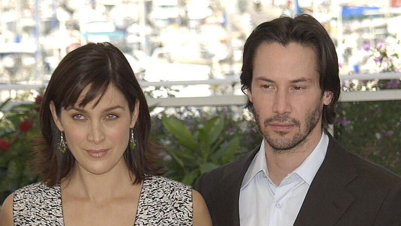 Carrie-Anne Moss und Keanu Reeves stehen wieder für einen "Matrix"-Film gemeinsam vor der Kamera. Carrie-Anne Moss und Keanu Reeves stehen wieder für einen "Matrix"-Film gemeinsam vor der Kamera.