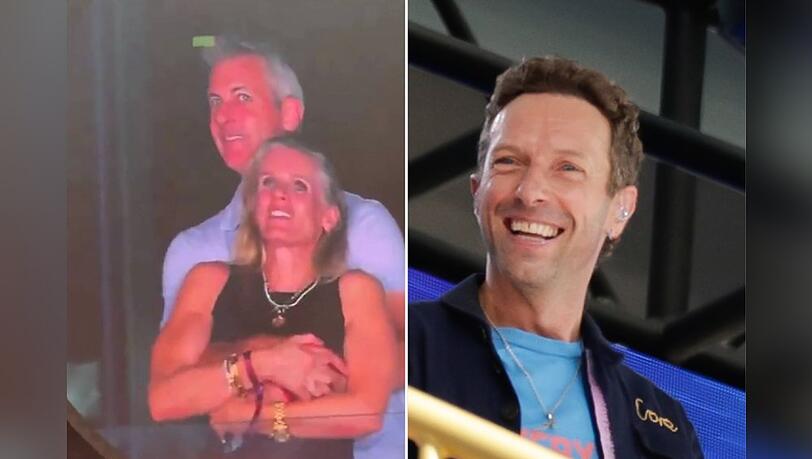 Coldplay-Frontmann Chris Martin kann sich das Lachen über den Kiss-Cam-Eklat nicht verkneifen.