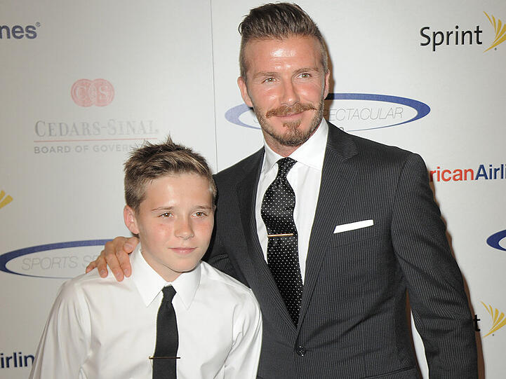 Routiniers auf dem roten Teppich: David Beckham und sein Sohn Brooklyn