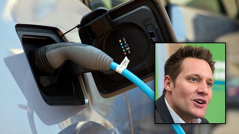 Ein Elektro-Auto an einem Ladekabel. Grünen-Politiker Ludwig Hartmann hofft im AZ-Interview auf eine Weiterentwicklung zukunftsfähiger Autos in Bayern.