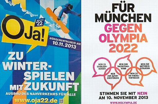 Die Plakate der Befürworter (li.) und der Gegner einer Bewerbung für die Olympischen Winterspiele 2022.