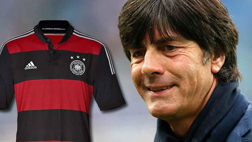 Schwarz mit roten Querstreifen: So sieht das neue Auswärtstrikot der Fußball-Nationalmannschaft von Bundestrainer Joachim Löw (r.) für die WM 2014 aus. Schwarz mit roten Querstreifen: So sieht das neue Auswärtstrikot der Fußball-Nationalmannschaft von Bundestrainer Joachim Löw (r.) für die WM 2014 aus.