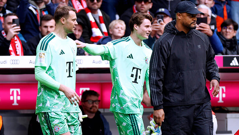 Manuel Neuer (l.) fällt aus, Jonas Urbig (M.) ersetzt ihn. Manuel Neuer (l.) fällt aus, Jonas Urbig (M.) ersetzt ihn.