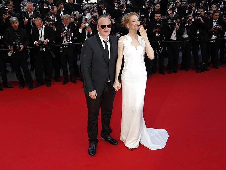 Zeigten sich wie ein Liebespaar auf dem roten Teppich von Cannes: Quentin Tarantino und Uma Thurman