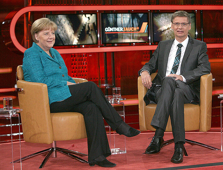 Für seine Politik-Intervies und Talkshows wurde Jauch auch oft kritisiert. Hier sprach er 2011 mit Bundeskanzlerin Angela Merkel.