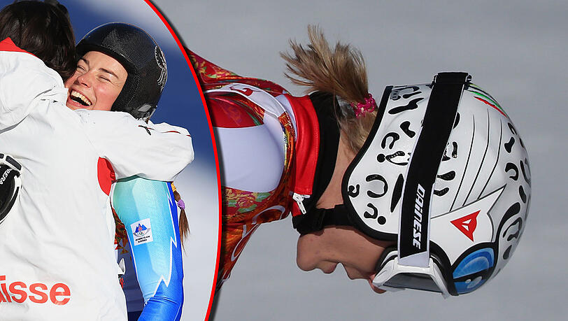 Enttäuscht schaut Maria Höfl-Riesch nach ihrem Lauf auf den Boden. Links umarmen sich Tina Maze und Dominique Gisin, die beide mit der gleichen Zeit Gold holten. Enttäuscht schaut Maria Höfl-Riesch nach ihrem Lauf auf den Boden. Links umarmen sich Tina Maze und Dominique Gisin, die beide mit der gleichen Zeit Gold holten.